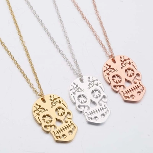 Three-piece skull pendant necklace set in gold, silver, and rose gold finishes