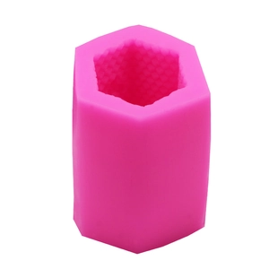 Pink hexagonal silicone mold with inner honeycomb texture for DIY candles and resin craft