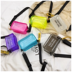 Detail shot of mini PVC jelly bags in six vibrant colors with adjustable black straps