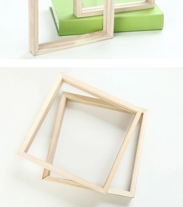 Macro shot of tiered natural pine wood DIY picture frames showcasing raw wood grain texture