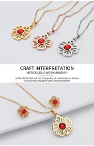 Detailed close-up of cutout flower jewelry set with red zircon in gold and silver