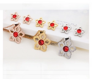 Detailed display of flower ruby crystal jewelry sets in gold, steel, and rose gold finishes