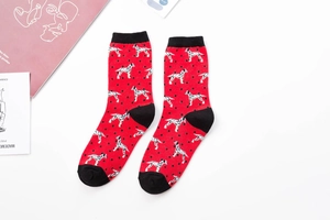 Detail of red cotton crew socks featuring cute dalmatian patterns and black accents
