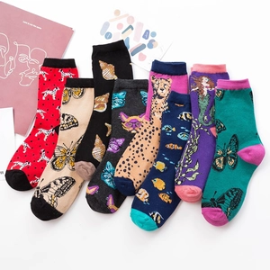 Set of eight colorful patterned cotton mid-calf socks for women featuring animal prints