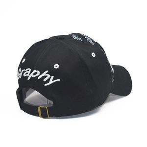 Rear view of black cotton baseball cap with white script embroidery and metal adjuster strap