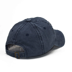 Detail view of the vintage washed navy cotton baseball cap with adjustable metal buckle