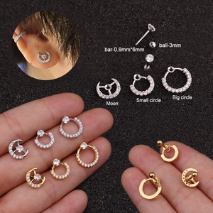 Macro view of 0.8mm stainless steel moon and circle cartilage studs with zircon inlay