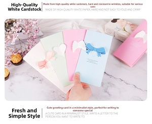 Detail view of premium 3D greeting cards with bows and angel wings on high-quality cardstock