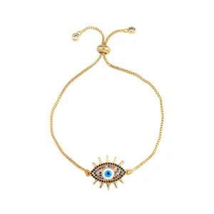Detailed close-up of golden Evil Eye bolo bracelet with colorful zircon and box chain link