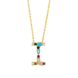 Macro shot of letter I pendant featuring colorful cubic zirconia on a gold chain