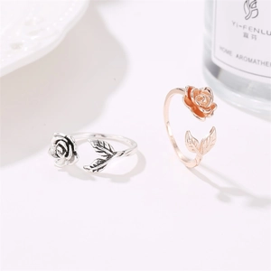 Detailed macro view of vintage rose and leaf open rings in antique silver and rose gold