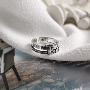 Detailed close-up of retro S925 sterling silver T-design ring with oxidized finish