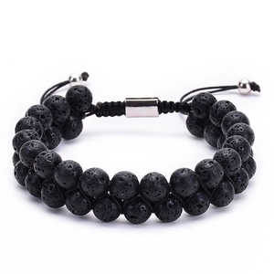 Close-up of double-layer black lava stone bracelet showing porous volcanic texture