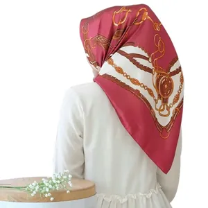 Detailed back view of vintage silk scarf featuring gold chain and red horsebit patterns