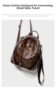 Detail view of vintage brown oiled leather backpack with multiple zipper pockets and metal rings