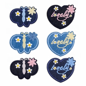 Detailed embroidery patches in butterfly and heart shapes for sweaters and shirts