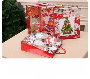 Detail showing four Christmas gift bags with festive patterns and sturdy red rope handles
