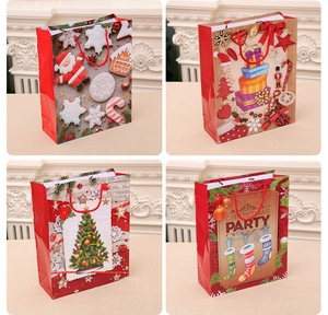 Detailed view of four festive Christmas kraft paper gift bags with red rope handles