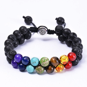 Macro view of double-layer chakra bracelet with volcanic stones and adjustable cord