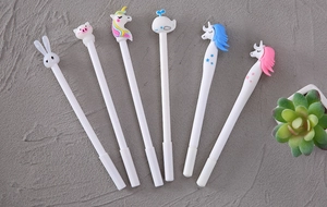 Detailed view of six white cartoon animal gel pens including rabbit and unicorn designs