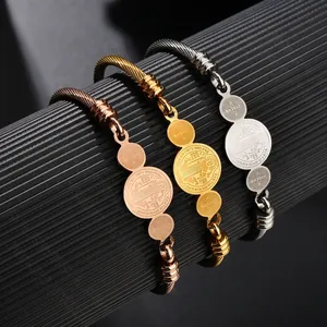 Three-tone Saint Benedict stainless steel twisted wire bracelets in gold, silver and rose gold