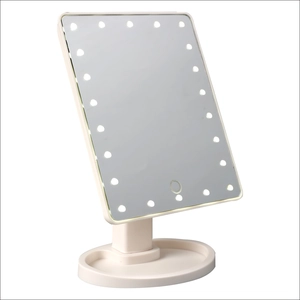 LED vanity mirror with storage base and 360-degree rotation in sleek white finish