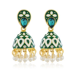 Detail of golden Jhumka earrings with green enamel and white pearl tassels