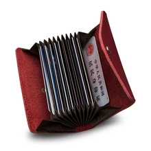 Macro shot of accordion-style card slots inside the burgundy leather business wallet