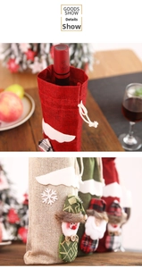 Detail showing rustic linen Christmas wine bottle bags with Santa and snowman patterns