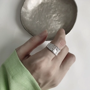 Irregular textured 925 sterling silver wide band ring with minimalist lava pattern finish