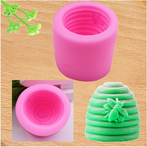 Pink silicone mold for honeycomb soap making with bees detail and 3D floral textures