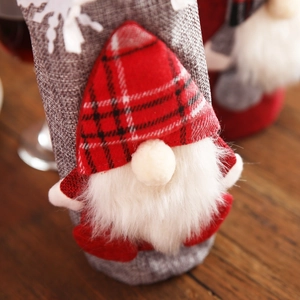 Christmas gnome wine bottle cover with red plaid hat and grey plush beard for festive decor