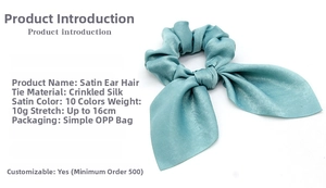 Detail of lake blue satin ear scrunchie made of crinkle satin fabric with 16cm stretch