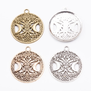 Round celestial charms with tree of life and pentagram designs in four metallic finishes