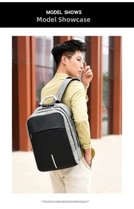 Outdoor view of gray anti-theft laptop backpack with combination lock and reflective strip