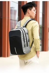 Detail of laptop backpack showing anti-theft combination lock and USB charging port