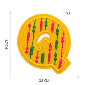 Letter Q embroidered alphabet patch with pink stripes on yellow felt base, 4.7cm height