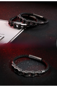 Industrial punk bracelet featuring black braided leather and matte black bicycle chain links