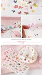 Detailed view of cute fruit and dessert stationery stickers in a lifestyle setting