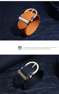 Detail of leather bracelets with lychee grain texture and gold horseshoe buckle accents