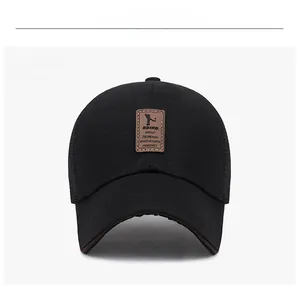 Front view of a black breathable cotton mesh baseball cap with brown leather EDIKO patch