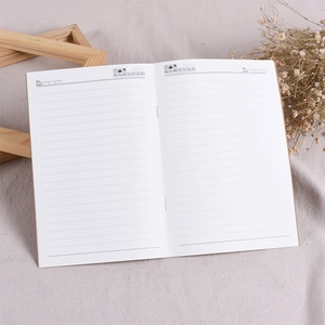 Detail view of ruled notebook pages with date, number, and weekly tracking layout