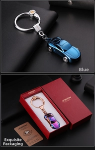 Detailed view of alloy car keychains in blue and iridescent colors with premium gift box
