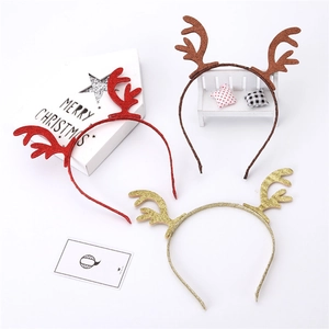 Three festive reindeer antler headbands in red, brown, and gold glitter finishes