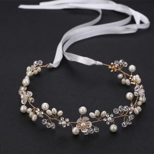Exquisite bridal headband with handmade pearls, crystals, and flowers on gold wire