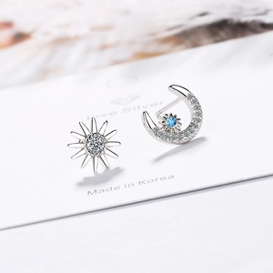 Silver sun and moon asymmetrical stud earrings with blue gemstone and white zirconias