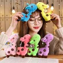 Colorful plush giraffe toys in six vibrant colors displayed with a warm festive background