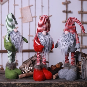 Three Christmas gnomes with striped telescoping legs in red, green, and grey colors