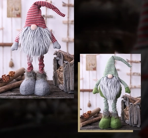 Detail of Christmas gnomes with striped hats and plush beards on a rustic wood background