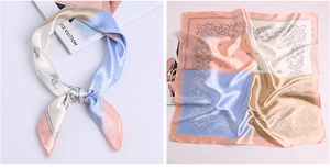 Detail of silk-satin square scarf featuring vintage paisley patterns and floral designs
